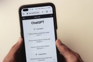 A caregiver using ChatGPT on their cellphone