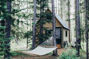 A small cabin next to a hammock, highlighting the power of caregiver retreats