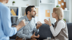 Siblings trying to work together while talking to a mediator, highlighting the idea of caregiver sibling resentment