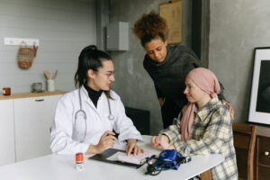 A senior and her daughter with a doctor talking about advance planning and advance planning FAQs